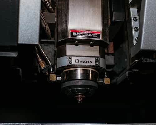 sparks flying as a machine is laser cutting