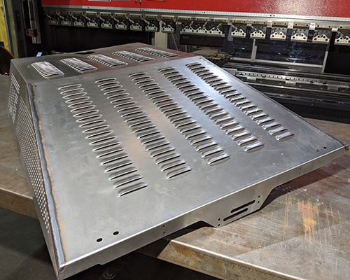 large pieces of metal laying on wood.