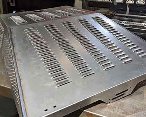 close up of an operator bending metal.